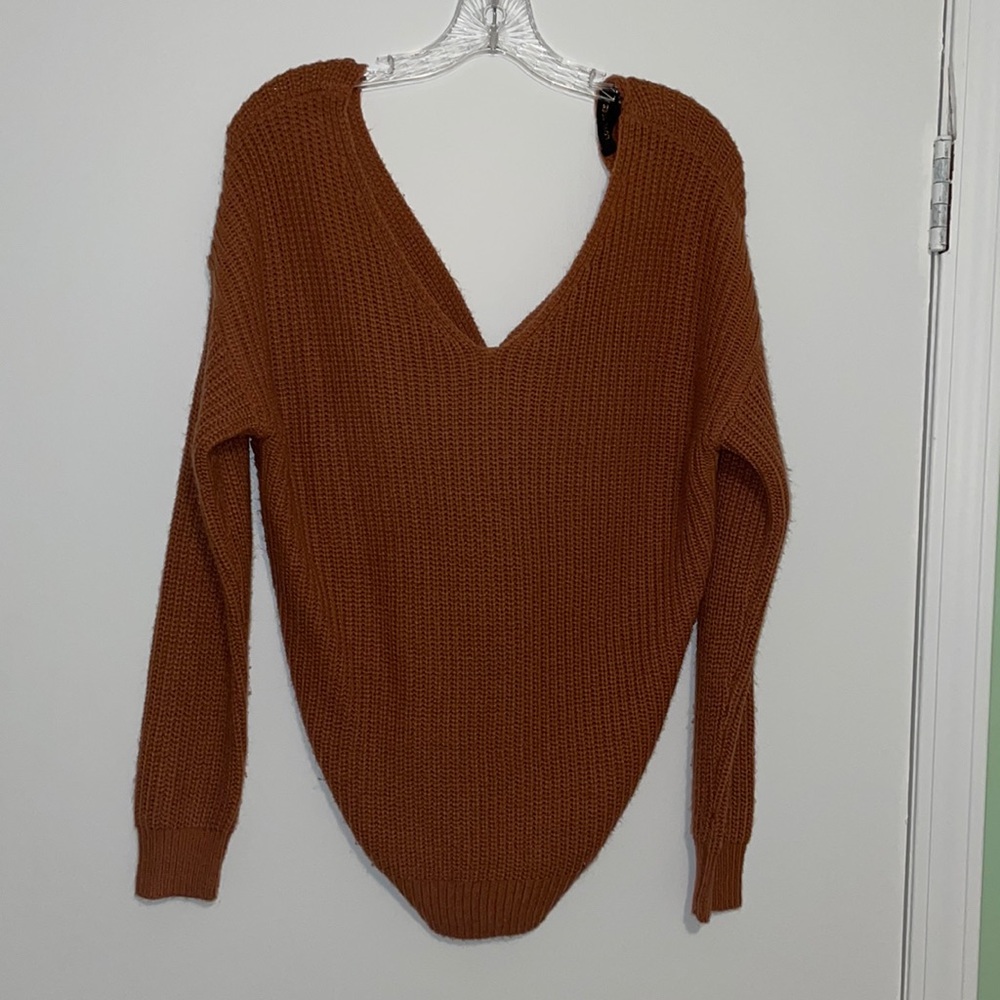 Orange colored sweater with back detail size: small